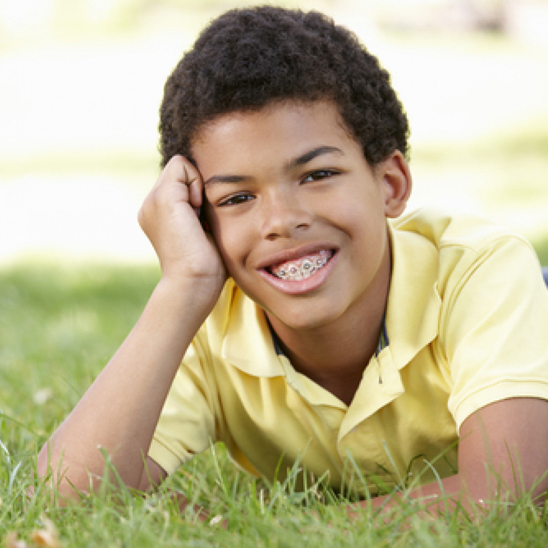 Child with Braces - The Kids Dentist & Orthodontics